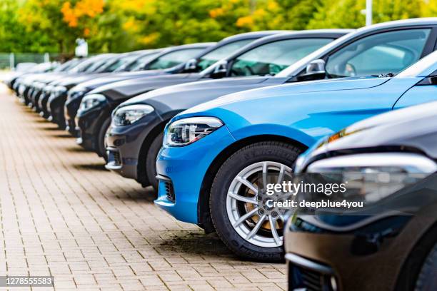 Hamburg, Germany - Oktober 04. 2020: A row of used BMW cars parked at a public car dealership in Hamburg, Germany. No people in this picture